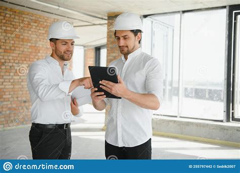 Two Young Man Architect On A Building Construction Site Stock Photo