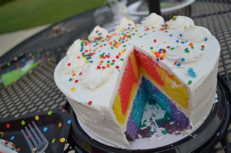 Rainbow Marble Cake With Vanilla Frosting And Sprinkles