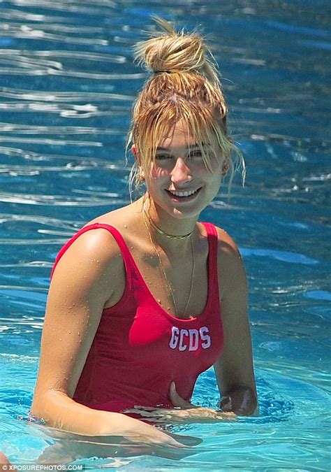 hailey baldwin dons red baywatch inspired swimsuit to take a dip in miami pool daily mail online