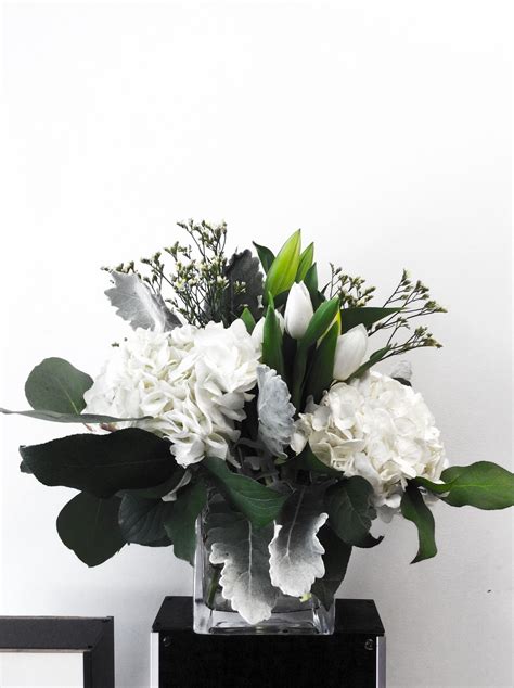 Taking modernist floral design to a new level, amac builds on its tradition of clean lines and clear containers. A custom floral arrangement in a square vase, designed by ...