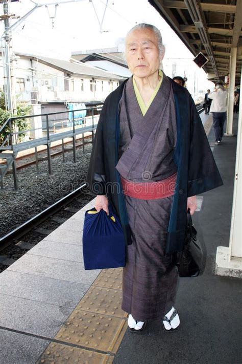 Japanese Tradition A Japanese Old Man In Traditional Clothes Is