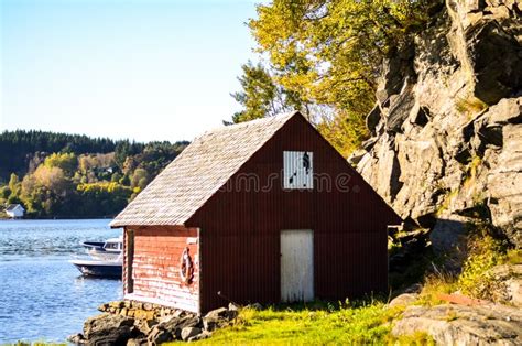 Traditional Scandinavia Falun Red Wooden House At Fjord Stock Photo