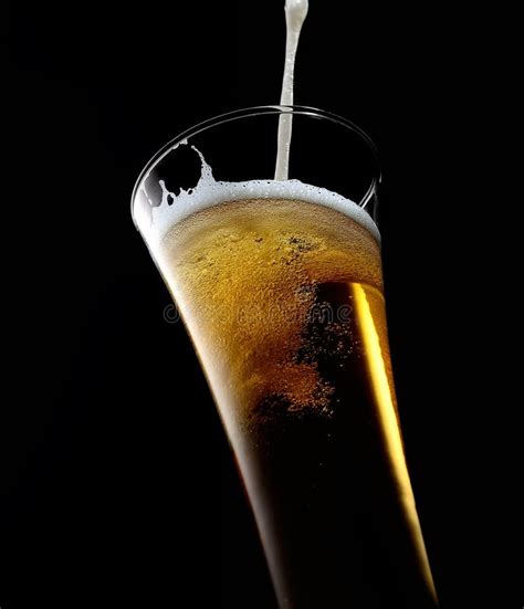 Beer Is Pouring Into Glass On Black Stock Image Image Of Beverage