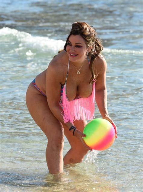Lisa Appleton Is Back On The Beach With Everything On Show In Plunging