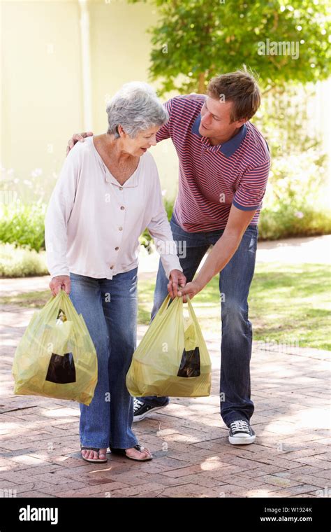 Old Lady Carrying Heavy Shopping Hi Res Stock Photography And Images