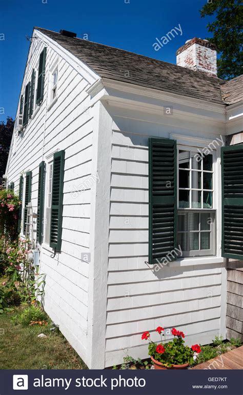 White Cape Cod House With Green Shutters In Wellfleet