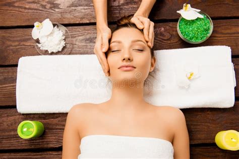 Relaxed Young Woman Laying In Spa Salon With Closed Eyes And Having Massage Stock Image Image