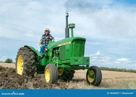 Vintage John Deere Tractor Pulling A Plough Editorial Photography
