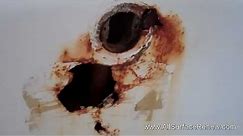 Large Rusted Holes in Bathtub Repair and Refinish