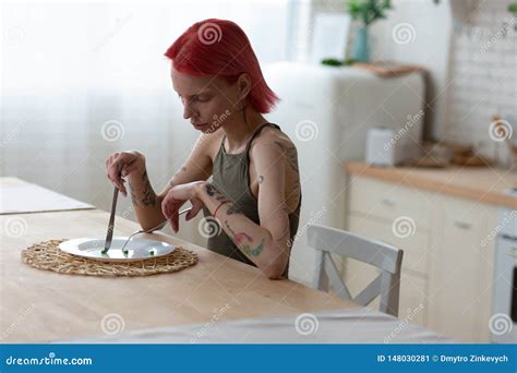 Woman With Eating Disorder Eating Nothing Suffering From Anorexia Stock