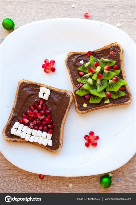 Our best christmas desserts include cookies, pies, gingerbread, and one showstopping cupcake wreath. Creative ideas for fruit trays | Chocolate sandwich with pomegranate and marshmallow Santa hat ...