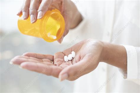 Pouring Pills Into Hand Stock Image F0331777 Science Photo Library