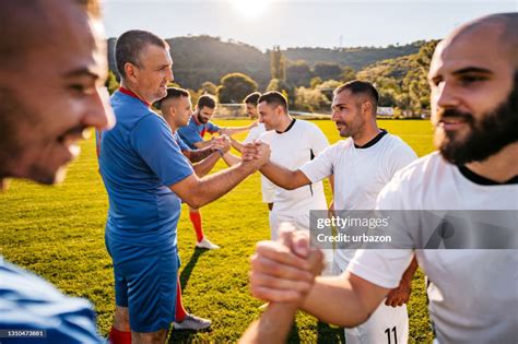 Soccer Players Shaking Hands Before The Match High Res Stock Photo