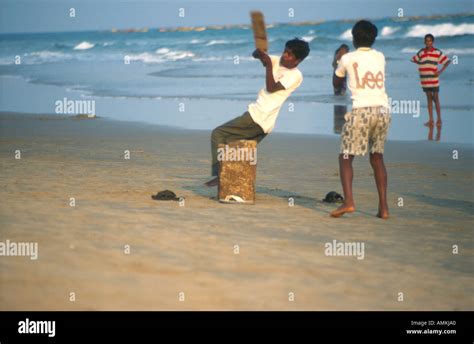 Children Playing Cricket On The Beach In Puri Orissa India Stock Photo
