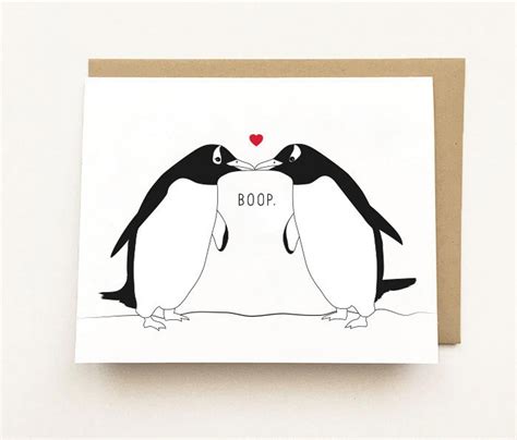 Two Penguins Kissing Each Other With The Words Boop Written On Their