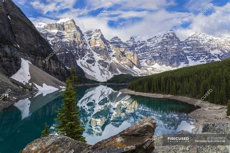 Rocky Mountains Reflecting In Moraine Lake In Banff National Park
