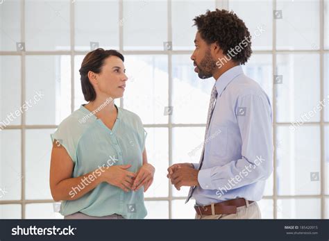 Two Young Business People Having Conversation Stock Photo 185420915