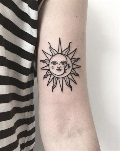A Sun And Moon Tattoo On The Arm
