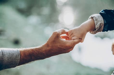 Father And Son Holding Hands Outdoors Andrews Church Of Christ