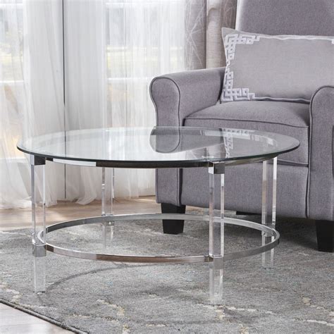 Flume coffee table features a smoked glass table top supported by minimal steel legs. Shop Elowen Round Rectangle Glass Coffee Table by ...