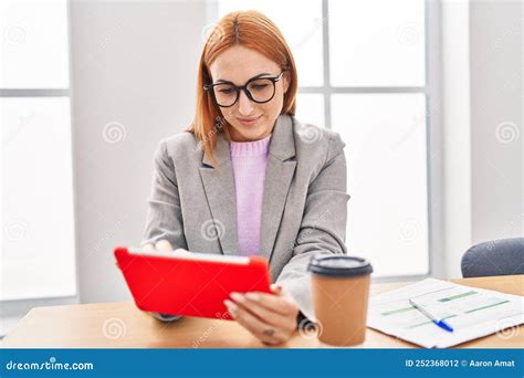 Young Caucasian Woman Business Worker Smiling Confident Using Touchpad