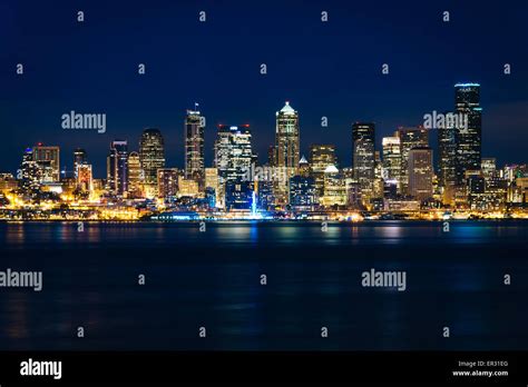 The Seattle Skyline And Elliott Bay At Night Seen From West Seattle