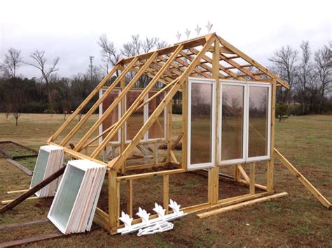 Old window greenhouse , using recycled windows from one neighbor who was replacing all the windows on her house, and a couple of old doors the greenhouse above uses a larger amount of wood in the design to reduce the amount of windows needed in construction. He Builds a Greenhouse from Old Windows | Home Design, Garden & Architecture Blog Magazine