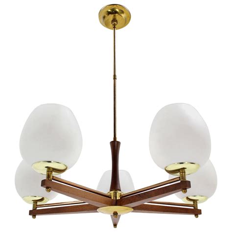 The fixture can use a standard bulb or led. Champagne Glass Shade Danish Modern Light Fixture at 1stdibs