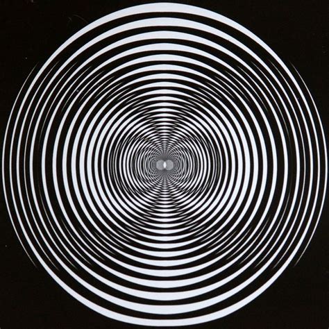 The Black And White Keep Spinning Around And Around In This Image We