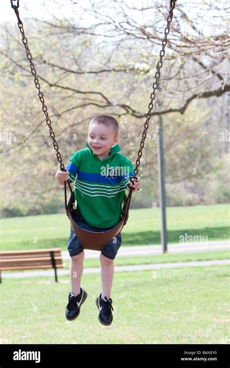 Child Swinging Legs Hi Res Stock Photography And Images Alamy