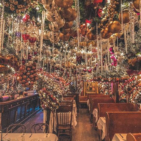 a restaurant decorated for christmas with hanging decorations