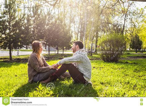 Romantic Young Couple In Love Relaxing Outdoors In Park Stock Image
