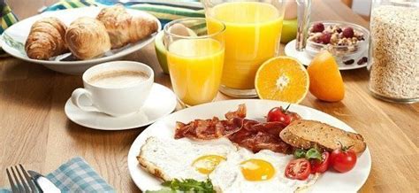 Set a breakfast table with a farm country theme featuring chickens and roosters and a sassy pig. Breakfast Table Setting
