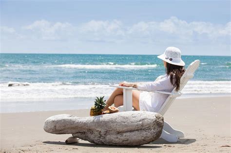 Woman Relaxing At A Paradisiac Tropical Beach In A Beautiful Sunny Day