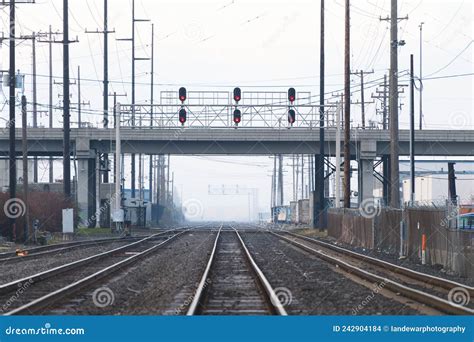 Train Tracks In The Mist Pass Under The Spokane Street Viaduct In