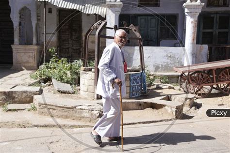 Image Of Indian Old Man Walking With A Stick Az831489 Picxy
