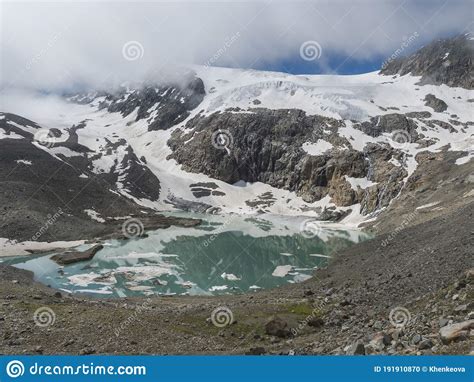 Summer View Of The Sulzenauferner Glacier And Turquoise Glacial Lake