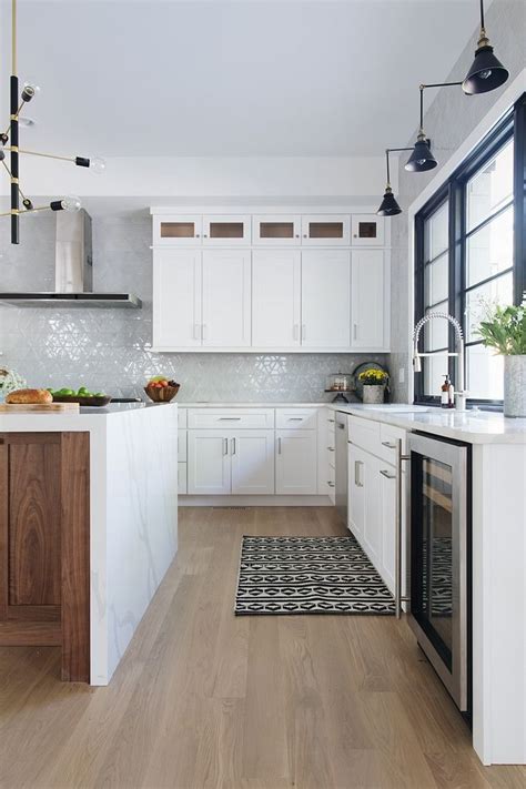 In fact, all three types—engineered wood, laminate, and vinyl or resilient—increased in popularity from. White kitchen cabinets, stained underside of island to ...