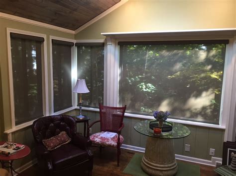 Solar Screen Roller Shades In A Sunroom Blocks Out Light And Heat