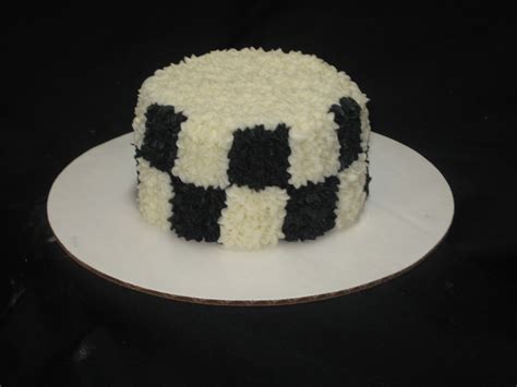 A Black And White Cake On A Plate