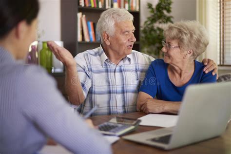 senior couple with financial advisor stock image image of digital home 58787657
