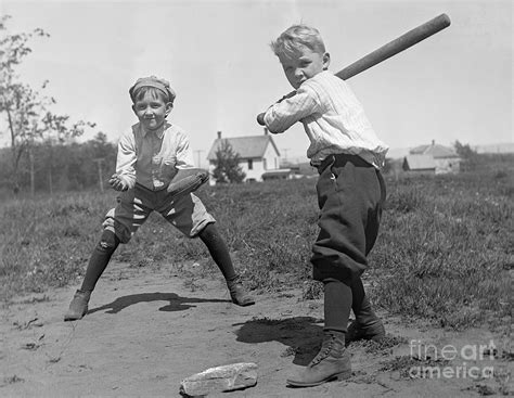 Two Boys Playing Baseball By Bettmann