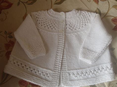 Easy pullover baby sweater with pocket in stockinette and seed stitch. Pure Cashmere Baby Matinee Jacket / sweater by ...