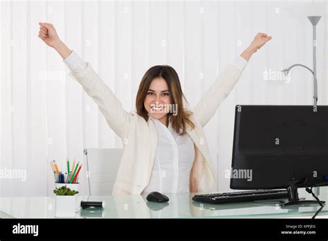 Businesswoman Raising Her Arms Stock Photo Alamy