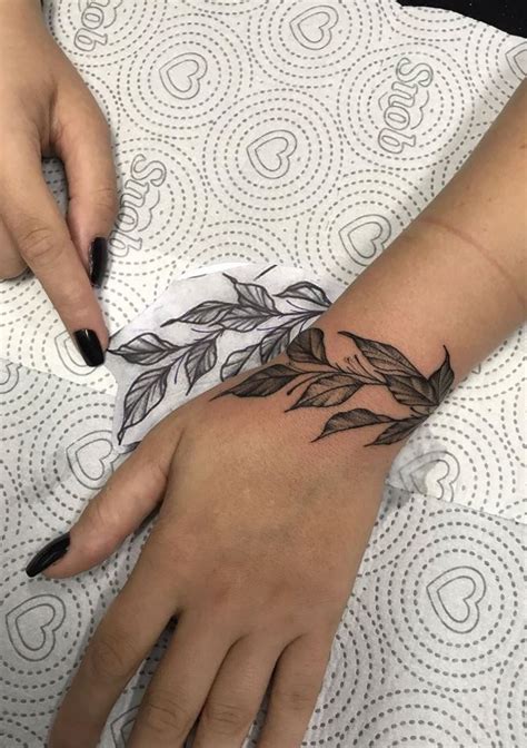 Leaf Bracelet Tattoo Get An Inkget An Ink Wrap Around Wrist Tattoos