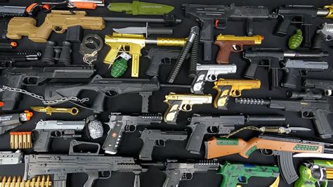 Dozens Of Dangerous Bead Firing Pistols Realistic Rifles Toy Guns For