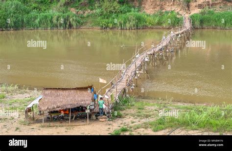 Bamboo Bridge Over The Nam Kahn River Near Its Confluence With The