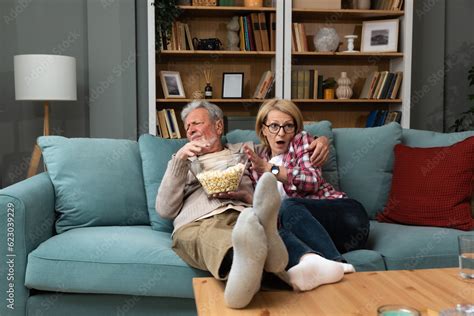 Old Retired Age Couple Watching Tv At Home Old Mature Couple Cheering
