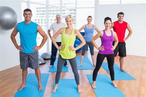 Premium Photo Happy People Exercising In Gym Class