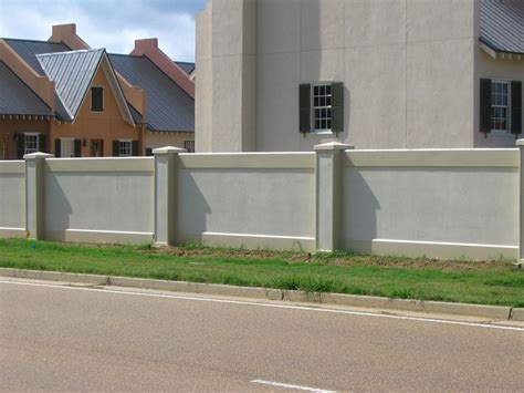 Example Of A Stucco Retaining Wall House Gate Design Exterior Wall